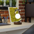 Lunar Levitation magnetic floating moon lamp rotating above its base with a warm glow in a dark room
