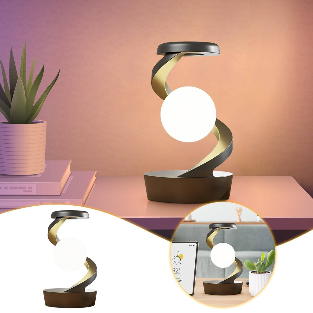 Lunar Levitation magnetic floating moon lamp rotating above its base with a warm glow in a dark room - view 3 of 3