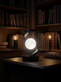 Lunar Levitation moon lamp floating above its base in a moody study