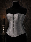 Silverthorn brocade steel-boned corset on black velvet dress form with candlelight