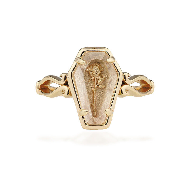 Selected Gold Thorned Rose Coffin Ring shown front-on, with an open band and coffin-shaped face containing a rose motif